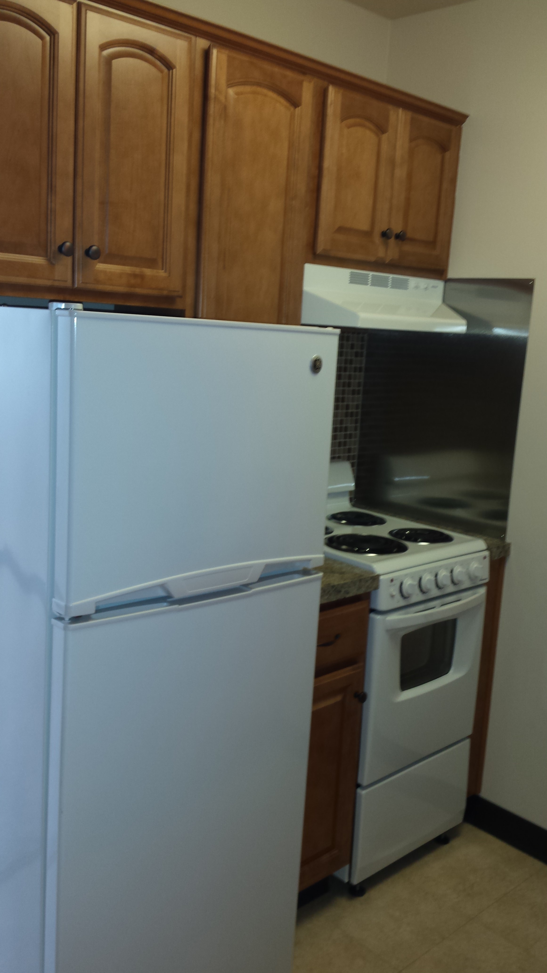 Senior One Bedroom Apartment Kitchen Stove and Refrigerator